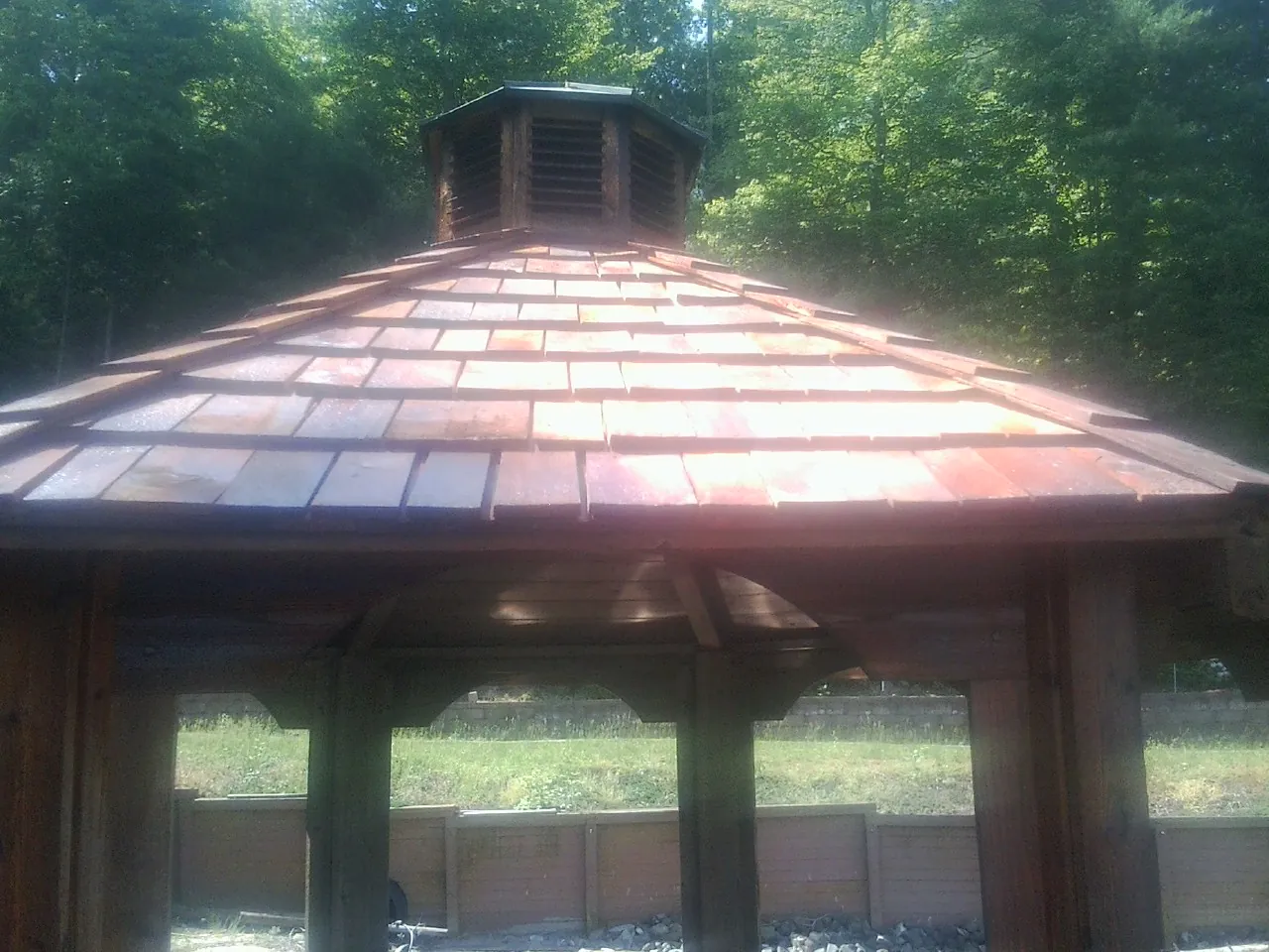 New cedar shake roof and cupola on a lakeside gazebo in Mattaponi
